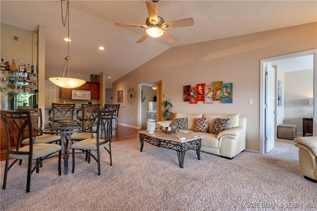 58 Jonathan Dr Unit 4B, Lake Ozark, MO 65049 - living area featuring lofted ceiling, ceiling fan, baseboards, and light colored carpet