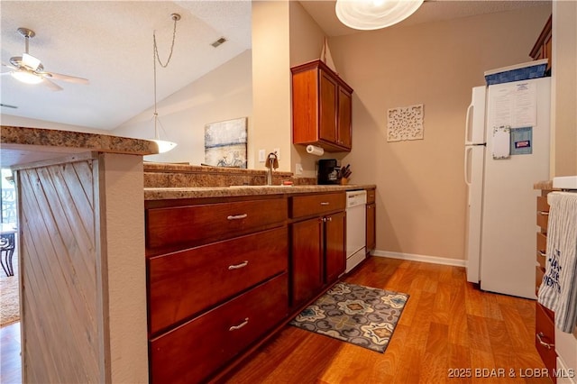 58 Jonathan Dr Unit 4B, Lake Ozark, MO 65049 - kitchen with white appliances, light wood-type flooring, vaulted ceiling, a ceiling fan, and baseboards