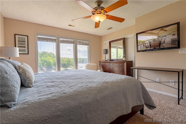58 Jonathan Dr Unit 4B, Lake Ozark, MO 65049 - bedroom with carpet floors, baseboards, ceiling fan, and a textured ceiling