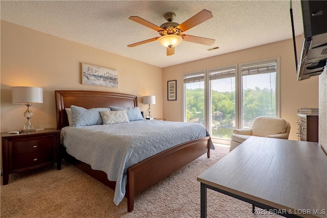 58 Jonathan Dr Unit 4B, Lake Ozark, MO 65049 - bedroom with a textured ceiling, light carpet, and ceiling fan