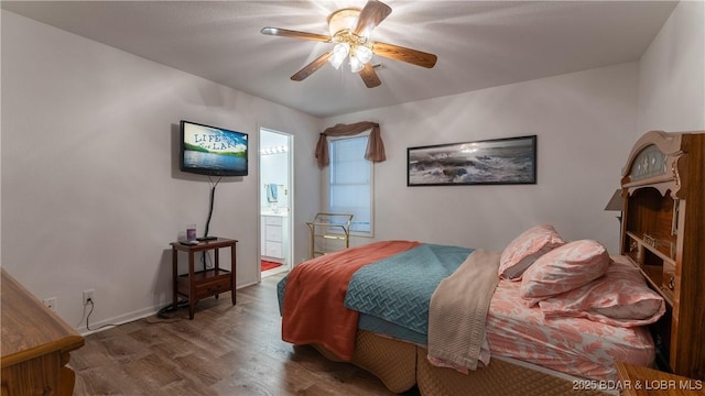 141 Wye Dr, Lake Ozark, MO 65049 - bedroom with wood finished floors, ensuite bath, a ceiling fan, and baseboards