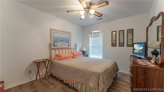 141 Wye Dr, Lake Ozark, MO 65049 - bedroom with wood finished floors, baseboards, and ceiling fan