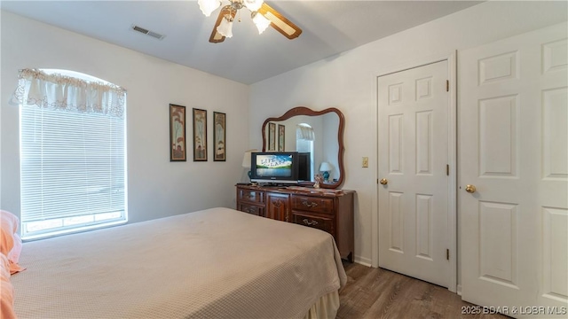 141 Wye Dr, Lake Ozark, MO 65049 - bedroom with wood finished floors and ceiling fan
