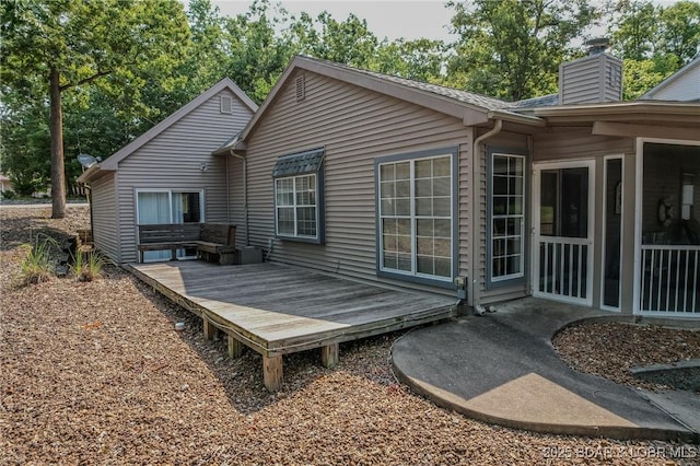 141 Wye Dr, Lake Ozark, MO 65049 - back of property with a wooden deck and a chimney