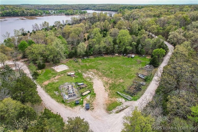 aerial view of a nearby body of water and a heavily wooded area