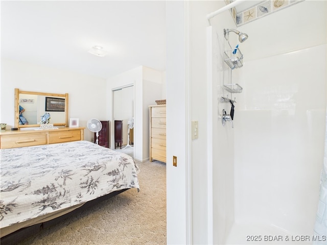 bedroom featuring light colored carpet and a closet