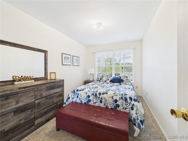 bedroom featuring carpet floors and baseboards