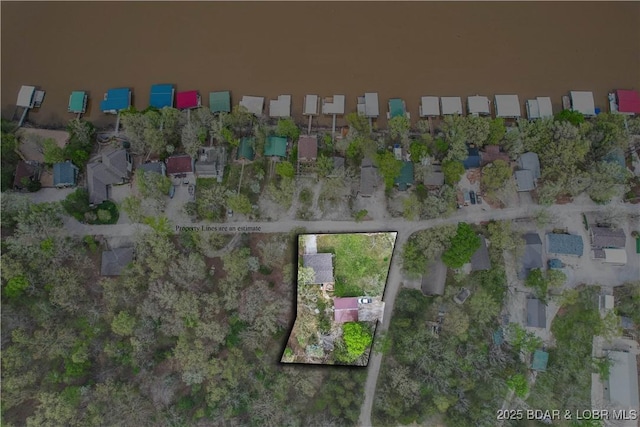 aerial view of property and surrounding area with nearby suburban area