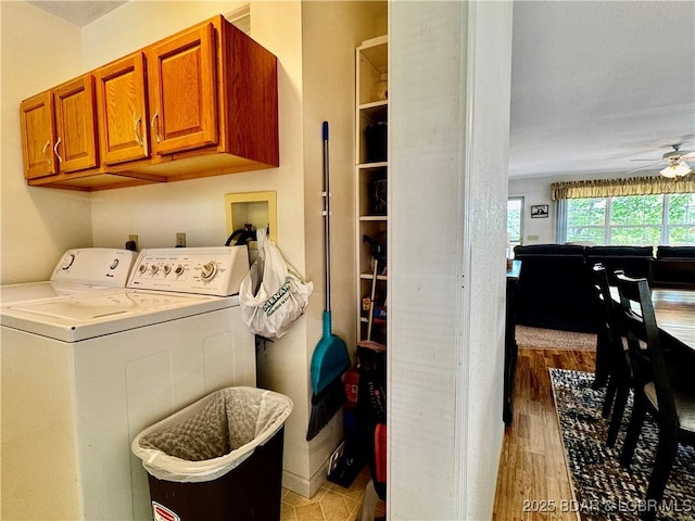 34 Glenmeadows Ct, Linn Creek, MO 65052 - washroom featuring cabinet space, a ceiling fan, washing machine and clothes dryer, and light wood finished floors