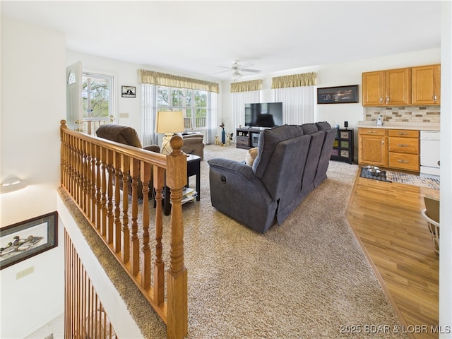 34 Glenmeadows Ct, Linn Creek, MO 65052 - living room with light wood finished floors, plenty of natural light, and a ceiling fan