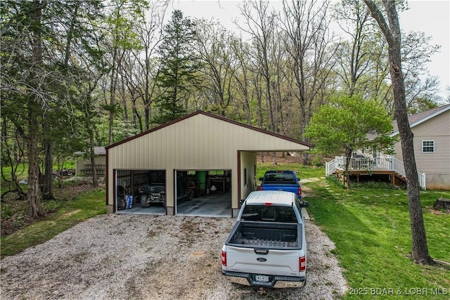 34 Glenmeadows Ct, Linn Creek, MO 65052 - view of parking / parking lot featuring a detached garage
