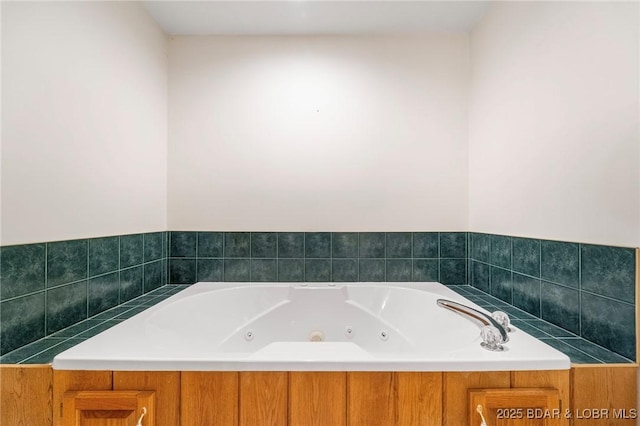 full bathroom with a jetted tub