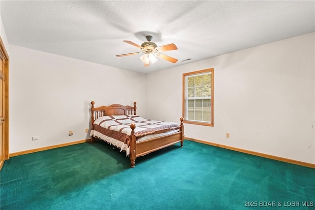 carpeted bedroom featuring baseboards, a ceiling fan, and a textured ceiling