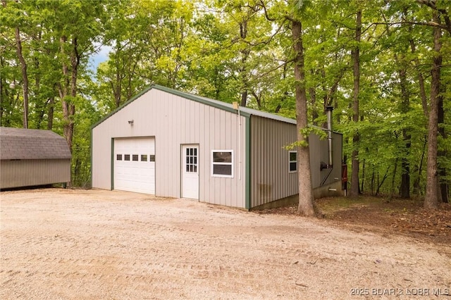 detached garage featuring driveway
