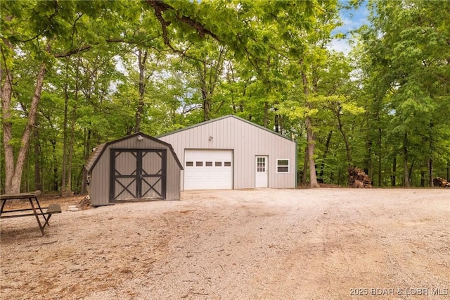 detached garage featuring driveway