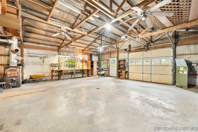 garage featuring ceiling fan and a garage door opener
