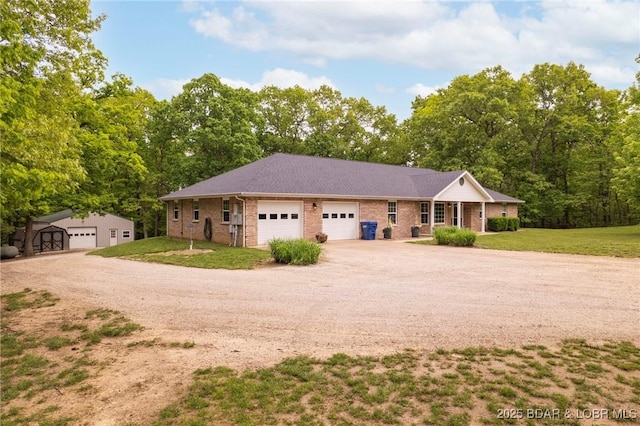 single story home with brick siding, dirt driveway, and a front lawn