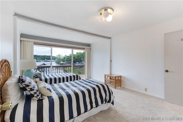 carpeted bedroom featuring access to outside