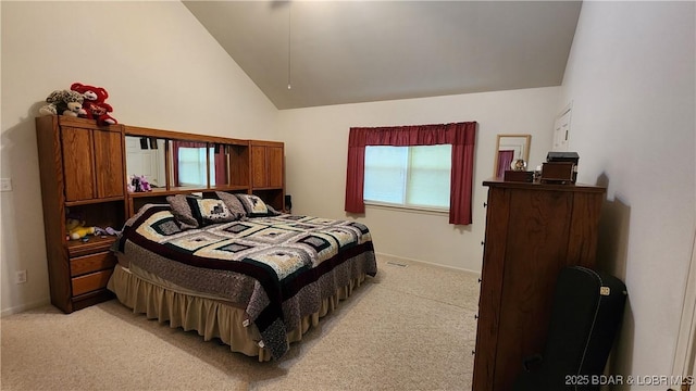 bedroom featuring light carpet, baseboards, and high vaulted ceiling