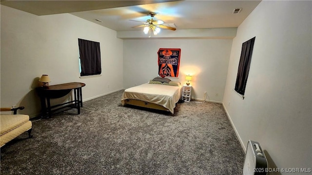 carpeted bedroom featuring baseboards and ceiling fan