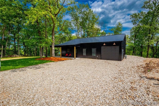 garage with gravel driveway