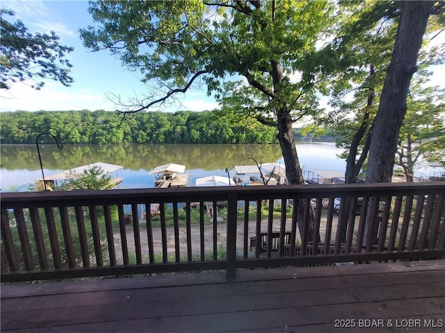 deck with a water view and a boat dock