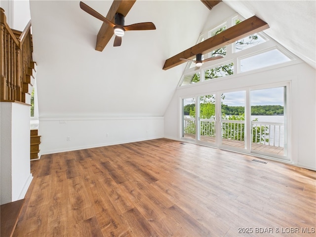 27294 Marina Ln, Barnett, MO 65011 - additional living space with beam ceiling, a ceiling fan, stairs, wood finished floors, and baseboards