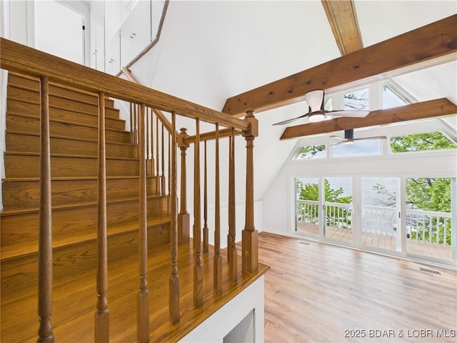 27294 Marina Ln, Barnett, MO 65011 - stairway featuring high vaulted ceiling, a ceiling fan, beam ceiling, and wood finished floors