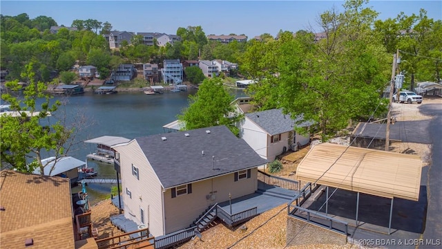 aerial view of residential area with a large body of water