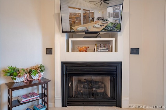 85 Monarch Cove Ln Unit 2C, Lake Ozark, MO 65049 - detailed view of a fireplace, a ceiling fan, and baseboards