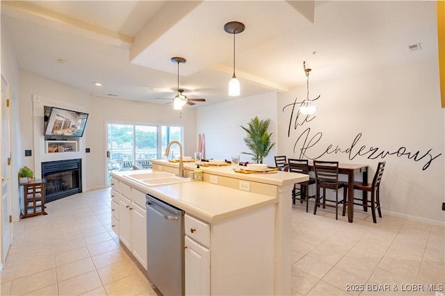 85 Monarch Cove Ln Unit 2C, Lake Ozark, MO 65049 - kitchen featuring a sink, light tile patterned floors, a glass covered fireplace, dishwasher, and ceiling fan
