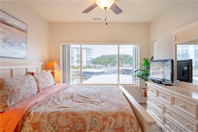 85 Monarch Cove Ln Unit 2C, Lake Ozark, MO 65049 - bedroom with access to outside, a ceiling fan, and baseboards