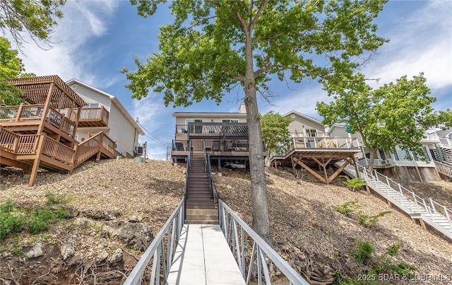 1104 Whippoorwill Ln, Sunrise Beach, MO 65079 - view of yard featuring stairway and a wooden deck