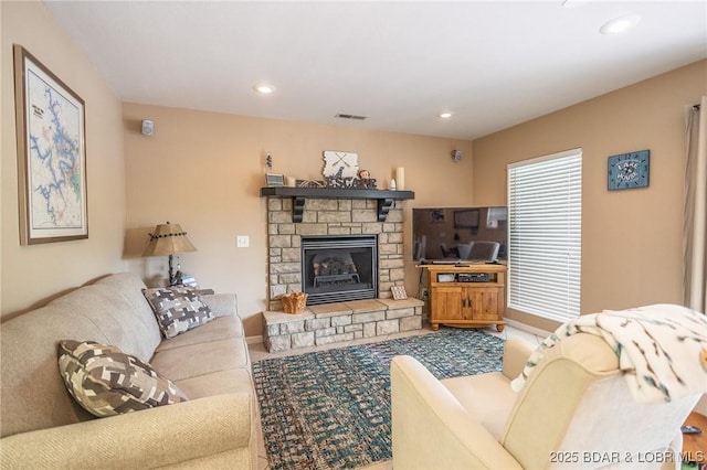 1104 Whippoorwill Ln, Sunrise Beach, MO 65079 - living area featuring a stone fireplace, recessed lighting, and baseboards