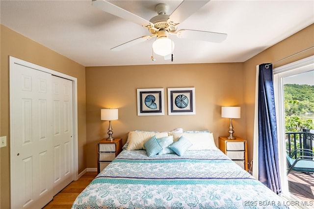 1104 Whippoorwill Ln, Sunrise Beach, MO 65079 - bedroom featuring access to exterior, wood finished floors, a closet, ceiling fan, and baseboards