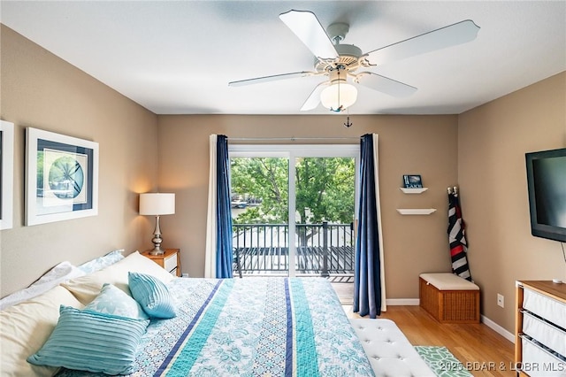 1104 Whippoorwill Ln, Sunrise Beach, MO 65079 - bedroom with access to outside, wood finished floors, baseboards, and a ceiling fan