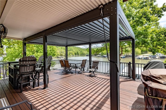 1104 Whippoorwill Ln, Sunrise Beach, MO 65079 - deck featuring outdoor dining space, a water view, and view of scattered trees