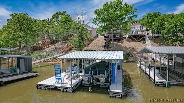 1104 Whippoorwill Ln, Sunrise Beach, MO 65079 - dock featuring boat lift, a water view, and stairway