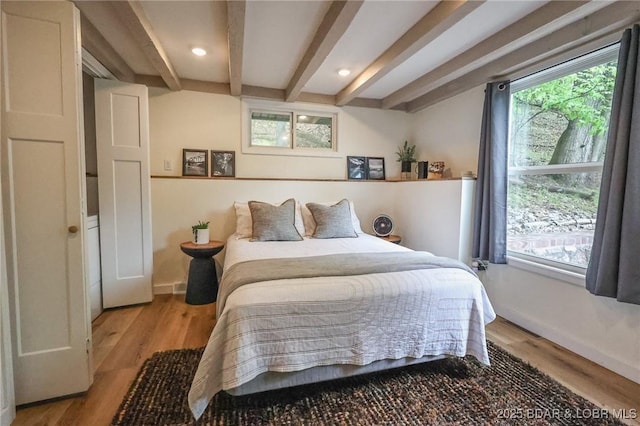 6076 Sioux Trl, Osage Beach, MO 65065 - bedroom featuring beam ceiling, wood finished floors, baseboards, and recessed lighting