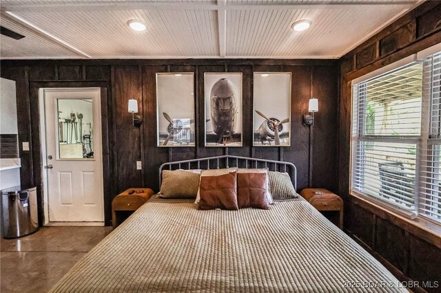 6076 Sioux Trl, Osage Beach, MO 65065 - bedroom with wood walls, finished concrete floors, recessed lighting, and wooden ceiling