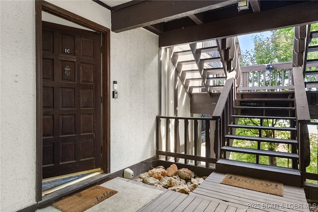 entrance to property with stucco siding