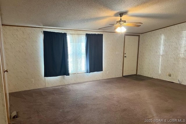 20877 Twin Hills Dr, Warsaw, MO 65355 - spare room featuring a textured wall, carpet floors, a textured ceiling, and ceiling fan