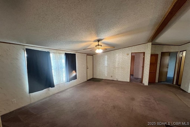 20877 Twin Hills Dr, Warsaw, MO 65355 - unfurnished bedroom with carpet floors, vaulted ceiling, a textured wall, a textured ceiling, and ceiling fan