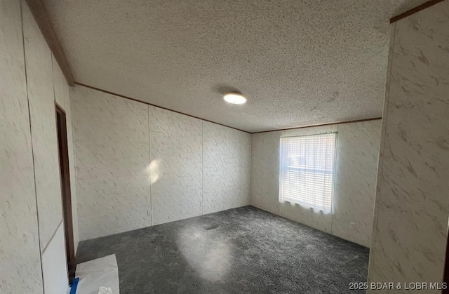 20877 Twin Hills Dr, Warsaw, MO 65355 - spare room featuring a textured ceiling and a textured wall