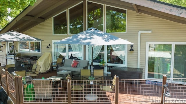 back of house with an outdoor living space and fence
