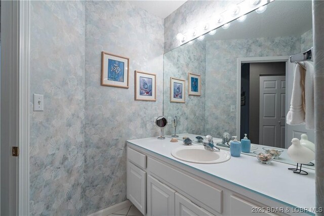 214 Emerald Bay Dr Unit 1D, Lake Ozark, MO 65049 - bathroom with vanity and tile patterned flooring