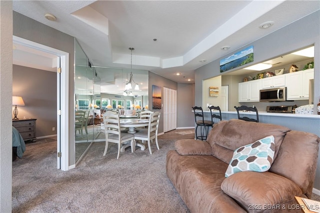 214 Emerald Bay Dr Unit 1D, Lake Ozark, MO 65049 - carpeted living area with a raised ceiling and recessed lighting