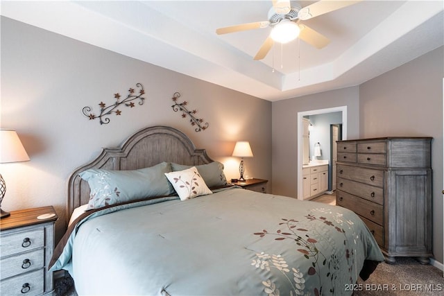 214 Emerald Bay Dr Unit 1D, Lake Ozark, MO 65049 - bedroom with light colored carpet, ensuite bathroom, a raised ceiling, and a ceiling fan
