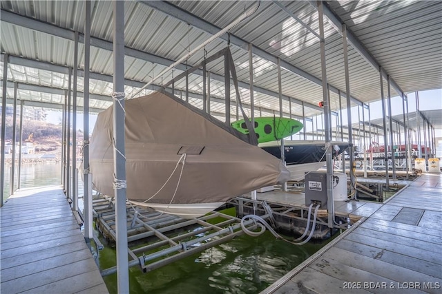 214 Emerald Bay Dr Unit 1D, Lake Ozark, MO 65049 - dock featuring boat lift and a water view