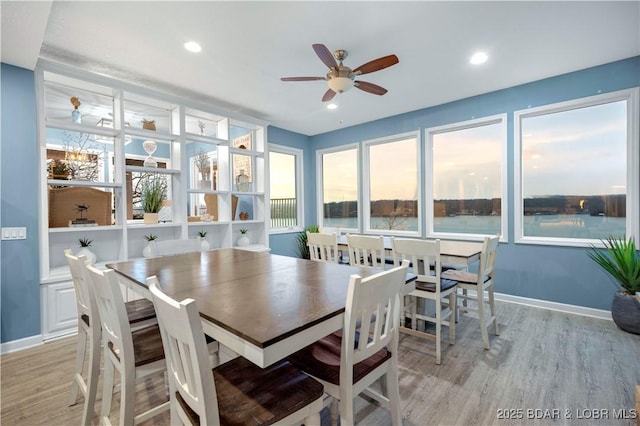 dining space featuring ceiling fan, light wood-type flooring, plenty of natural light, baseboards, and recessed lighting